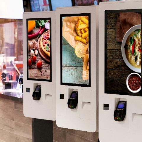 Three food ordering kiosks each with different cuisines.